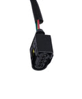 Black 6-pin automotive connector on a wiring harness with red, yellow, and green wires