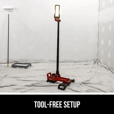 Compact Collapsible Tower Work Light With Foot Pedal Switch Hella Bright 12v And 20v Compatible Battery Power Tool Setup For Job Sites in a job site with a roller.