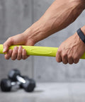 Wrist Strength Trainer Twist Bar For Real Grip Gains And Arm Power, durable green hand grip bar in use