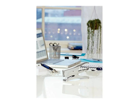 Classic K1 Plier Stapler, Chrome, Built To Last With 50 Sheet Capacity And Back Loading on office desk near laptop