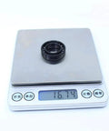 Badass 2 Piece High Temperature Thin Section Full Ball Bearing 17X30X7Mm Tb6903 weighing 16.74 grams on a scale.
