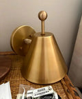Handcrafted Brass Wall Sconce with Finial Vintage Hardwired Light showcasing elegant finial and brass cone shade.