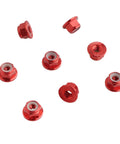 Tune Up Your Ride With These 8 Fresh Red M4 Flange Lock Nuts Built For 1 10 Scale Rc Cars Featuring Serrated Nylon Inserts And Lightweight Aluminum Wheels Upgraded Replacement Hardware. A close-up view of red M4 aluminum flange lock nuts with serrated nylon inserts.