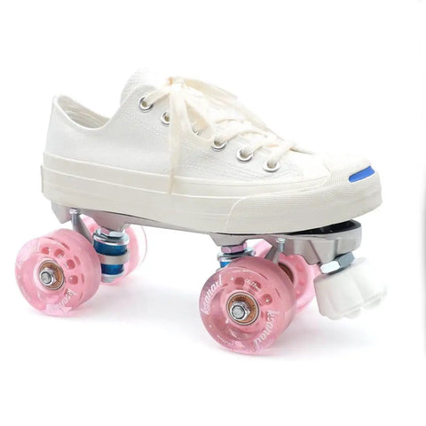Quad roller skate with pink wheels and Two Pack Cat Paw Toe Stops For Quad Roller Skates 82A Rubber Brake Blocks in white sneaker style.