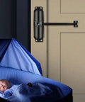Heavy Duty Automatic Door Closer Kit With Soft Close Function installed on door near sleeping baby in crib