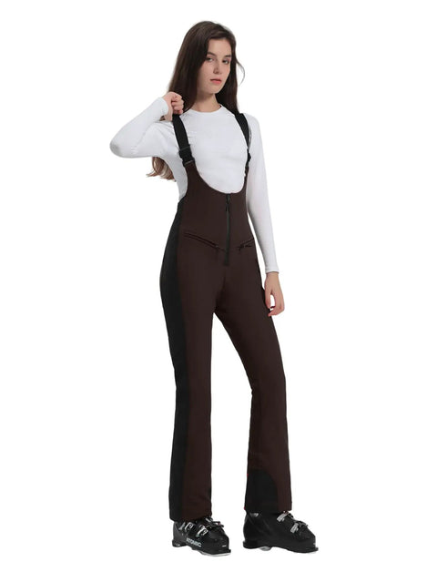 Woman wearing Womens Ski Bibs Snow Pants Waterproof Windproof Warm Insulated Snowboard Overalls For Winter Comfort High Elasticity And Slim Fit