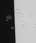 Close-up of black and white fabric with water droplets showing water resistance for Outdoor Chair Cushions Set Of 2 17 By 16 Inch With Ties Water Resistant All Weather U Shape Seat Pads For Patio Garden Balcony Indoors Or Outdoors Fade Resistant Black Stripe.