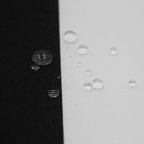 Close-up of black and white fabric with water droplets showing water resistance for Outdoor Chair Cushions Set Of 2 17 By 16 Inch With Ties Water Resistant All Weather U Shape Seat Pads For Patio Garden Balcony Indoors Or Outdoors Fade Resistant Black Stripe.