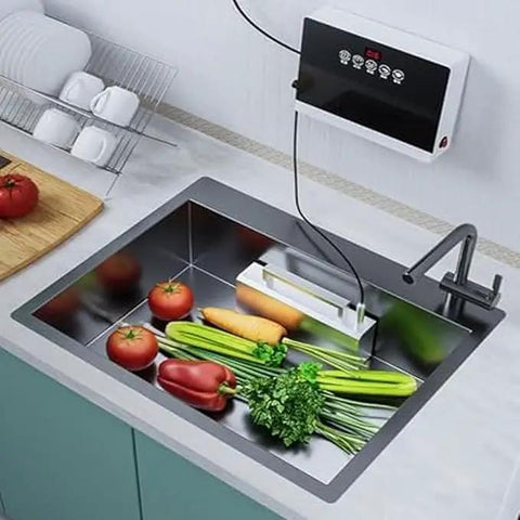 Compact Portable Dishwasher Featuring Slick Touch Controls And Rapid Water Drainage For Cranking Out Fresh Dishes Veggies And Seafood in a stainless steel sink with fresh produce.