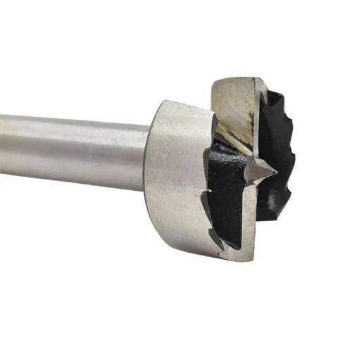 Close-up of Top Notch Hex Shank Forstner Bit Drills 30.6mm diameter, stainless steel, for clean coin mounting holes in hardwood.