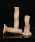 Premium PEEK Plastic Phillips Countersunk Flat Head Screws M6 X 40mm Pack Of Twenty showcasing three screws on a reflective surface.