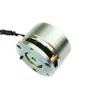 Front view of a small silver electromagnetic brake with round mounting plate and wired cable