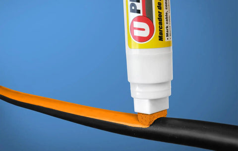 Large White Wire Marker With 15mm Tip For MCM Wire Up To Three Quarters Inch marking a black wire with orange ink