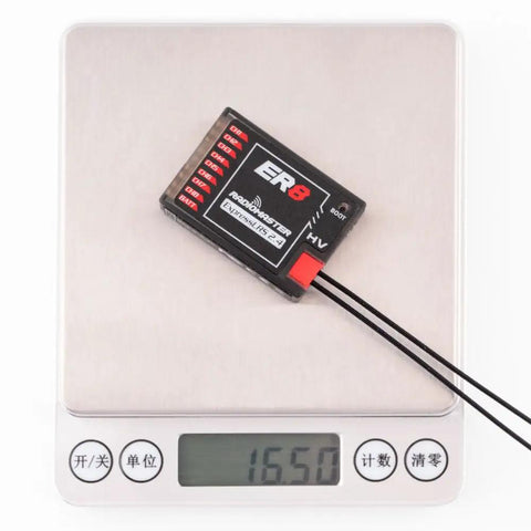 ExpressLRS ER8 2.4GHz 8 Channel PWM Receiver With Telemetry placed on digital scale showing 16.5 grams