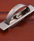Slick Hidden Cabinet Handles Pack Of Two Smooth Rotating Zinc Alloy Pulls In Brushed Nickel Finish No Sweat Setup To Refresh Your Drawers Or Closet Doors Quick mounted on wood surface.