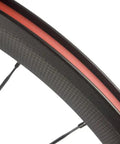Close-up view of the Ultra Light 700C Road Bike Carbon Clincher Wheelset with 38mm depth and basalt brake surface for Shimano cassettes.