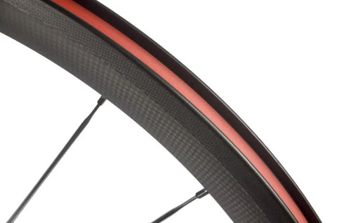 Close-up view of the Ultra Light 700C Road Bike Carbon Clincher Wheelset with 38mm depth and basalt brake surface for Shimano cassettes.