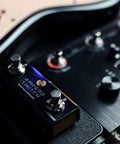 Close-up of Dual Footswitch Pedal For Guitar Effects Rig Gear Momentary 2-Way Foot Switch Controller With 6.35mm TRS Jack on pedalboard