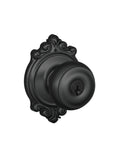 Georgian Door Knob With Brookshire Trim Keyed Entry Lock In Matte Black Finish, exterior view showing ornate trim detail.