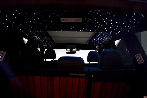 Fiber optic end-glow light cables installed on a car ceiling to create a starry sky with blue LEDs.