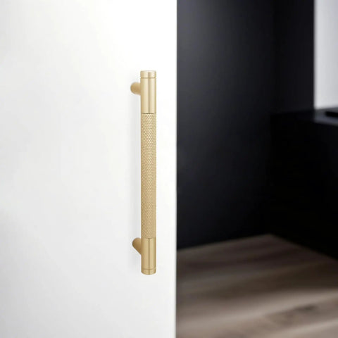 Top Shelf Brushed Gold Cabinet Pulls Deliver A Dead Sharp Knurled Grip For Modern Kitchen Drawers And Pantry Doors This 10 Pack Hardware Set Fits A Standard 5 Inch Hole Spacing on a sleek white cabinet.