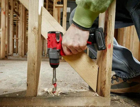 Compact 12V Cordless Drill Driver Kit With Brushless Motor And Heavy Grip Chuck Compatible With Milwaukee M12 Fuel Models drilling into wood.