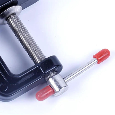 Close-up of Compact Mini Vise Clamp With A Rock Solid Hold for Woodworking, black finish and aluminum alloy screw mechanism.