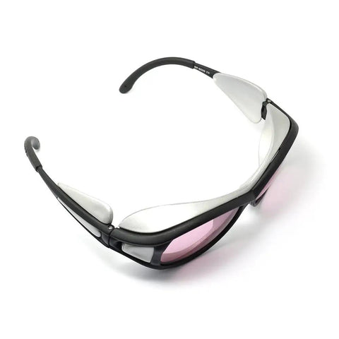 Kickass Protective Laser Safety Goggles For 808 NM Infrared Diode Lasers with a grey-black frame and pink lenses.