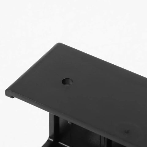 Close-up of the top plate of the Slick Under Desk Laptop Mount Bracket, made of heavy-duty black resin with a mounting hole.