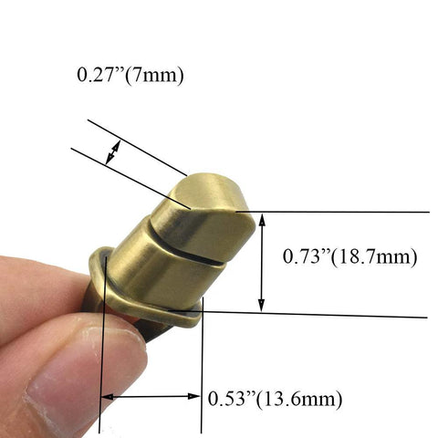 Antique-brass purse turn lock held by fingers; metal handbag hardware, 1.1 inch length