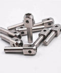 Set of stainless steel waterjet poppet pins for marble cutting machines; multiple cylindrical pins with square heads and through holes.