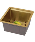 Workstation Ledge Undermount Stainless Steel Kitchen Sink With Grid, Cutting Board, Strainer And Basket, Gold Finish, 15 By 15 By 8 Inch Single Bowl, Durable Modern Design showcasing gold finish interior with lemon on grid.