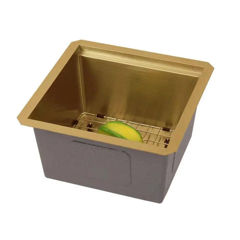 Workstation Ledge Undermount Stainless Steel Kitchen Sink With Grid, Cutting Board, Strainer And Basket, Gold Finish, 15 By 15 By 8 Inch Single Bowl, Durable Modern Design showcasing gold finish interior with lemon on grid.