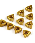 Ten gold WCMT2.52 55° diamond carbide turning inserts for CNC lathe and indexable tool holders, displayed on a white background.