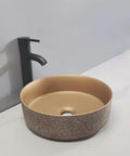 UMJIGF Bathroom Countertop Vessel Sink Bathroom Vessel Sink Bathroom Light Luxury Ceramic Basin round sink with textured exterior and faucet.