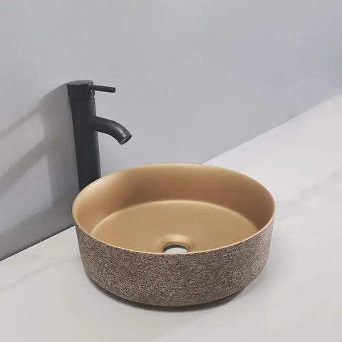 UMJIGF Bathroom Countertop Vessel Sink Bathroom Vessel Sink Bathroom Light Luxury Ceramic Basin round sink with textured exterior and faucet.