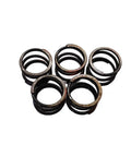 Top Tier Drop In Ready Heavy Duty Compression Spring Built Different To Handle Beast Mode Loads On Skid Steers While Running Smooth Through Any Rough Workday Today, four metal springs arranged.