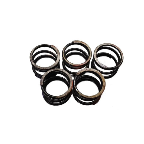 Top Tier Drop In Ready Heavy Duty Compression Spring Built Different To Handle Beast Mode Loads On Skid Steers While Running Smooth Through Any Rough Workday Today, four metal springs arranged.
