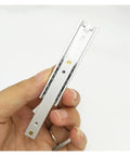 Top Shelf Side Mounted Ball Bearing Drawer Slides One Pair L140mm held in hand, steel construction for quiet cabinet use.