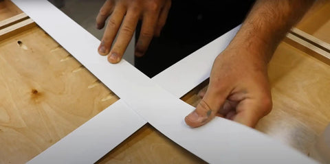 Hands using Template Material Kit With 20 Strips For DIY Countertops Showers Cabinets And Tables Create Custom Templates Fast.