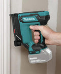 18V LXT Lithium Ion Cordless 23 Gauge Pin Nailer Tool Only Renewed with ergonomic grip, positioned for fine carpentry work.