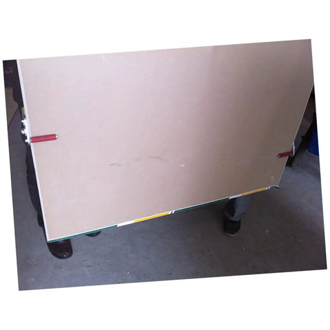 One Pair Heavy Duty Gypsum Board Lifter Designed For No Sweat Handling Of Glass And Ceramic Tile Panels With Adjustable Angles And Slick Grip For Effortless Job Site Moves lifting a large gypsum board.