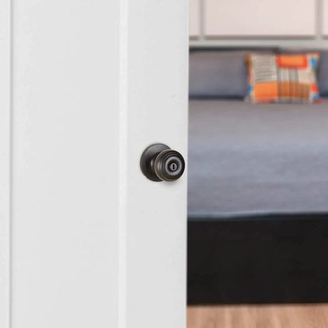 Classic Matte Black Door Knob With Lock For Bedroom And Bathroom, Brass Body, Steel Core, visible on a white door