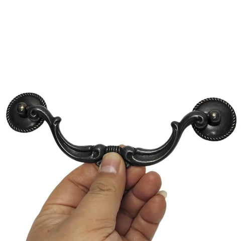 Person holding Vintage Drop Bail Cabinet Pulls 5.5 Inch 140mm Dresser Drawer Handles in Dark Antique Black, Rustic Kitchen Cabinet Hardware