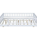 Full-Size Wood Daybed With Trundle And Fence Guardrails In White Finish shown without mattress ready frame
