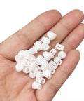 Hand holding Plastic 3/16 Inch Flush Hole Plugs With Snap In Locking Design Conceal Nail Holes Shelf And Cabinet Holes White Pack Of 100