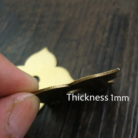Close-up of 4 Pack Brass Drawer Pulls Antique Brass Cabinet Ring Handles showing 1mm thickness with fingers holding the edge