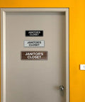 Standard Black Janitor's Closet Sign With Adhesive Tape For Easy Stick On Mounting, Durable Wall Signage With Clear Engraved Message, No Drilling Needed, Medium 1 Pack