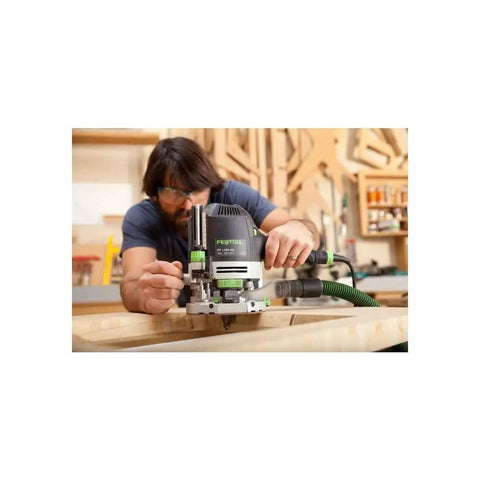 Person using Plunge Router Of 1400 EQ-F-Plus With Ergonomic Grip, Precise Depth Scale, Smooth Depth Adjustment for woodworking