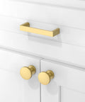 Close-up of white cabinets with 10 Pack Brushed Gold Cabinet Pulls 3 Inch 76mm Solid Zinc Alloy Drawer Handles For Kitchen Cabinets